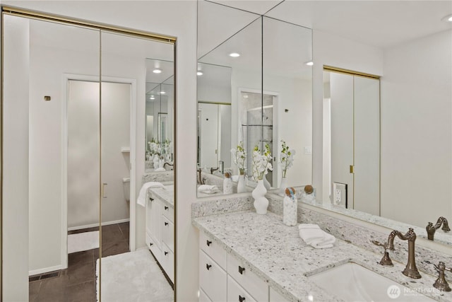 full bath with recessed lighting, vanity, and tile patterned floors