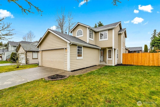 traditional-style house featuring a shingled roof, a front lawn, fence, driveway, and an attached garage