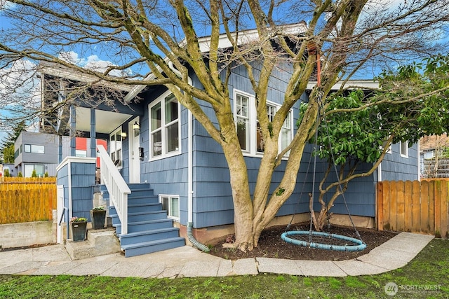 exterior space featuring stairs and fence