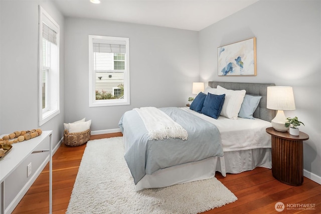 bedroom featuring recessed lighting, wood finished floors, and baseboards