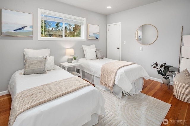 bedroom featuring recessed lighting, baseboards, and wood-type flooring