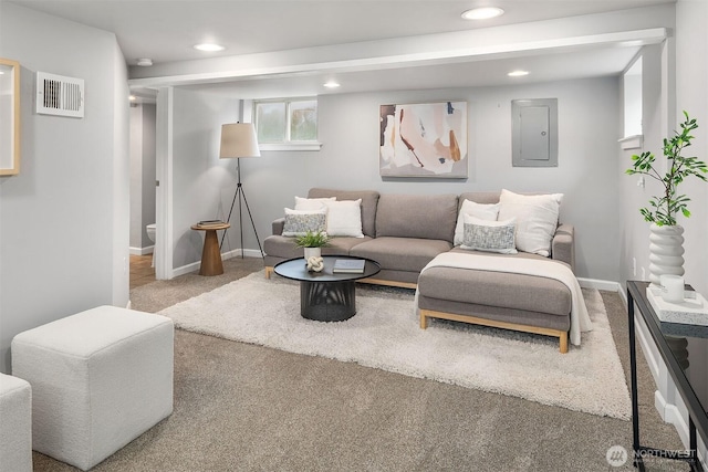 living area with visible vents, electric panel, recessed lighting, carpet floors, and baseboards