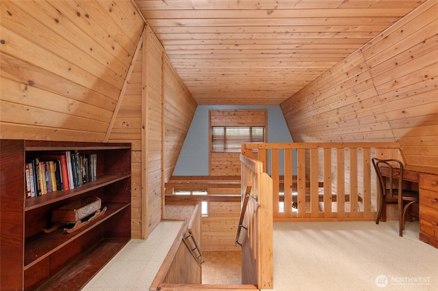 bonus room with wooden ceiling and wood walls