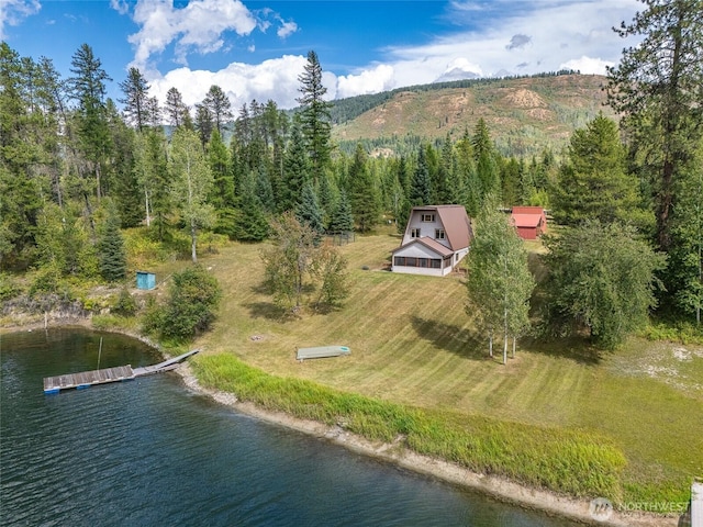 bird's eye view with a forest view and a water and mountain view