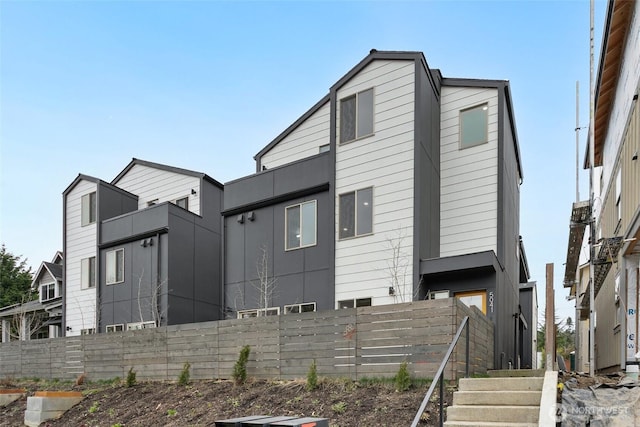 view of front of house with fence