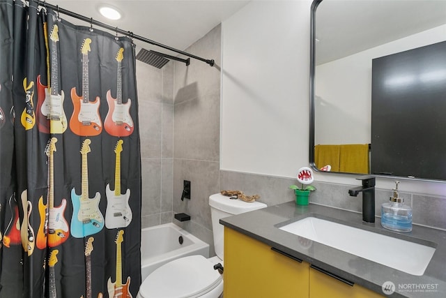 bathroom featuring vanity, toilet, and shower / bath combo with shower curtain