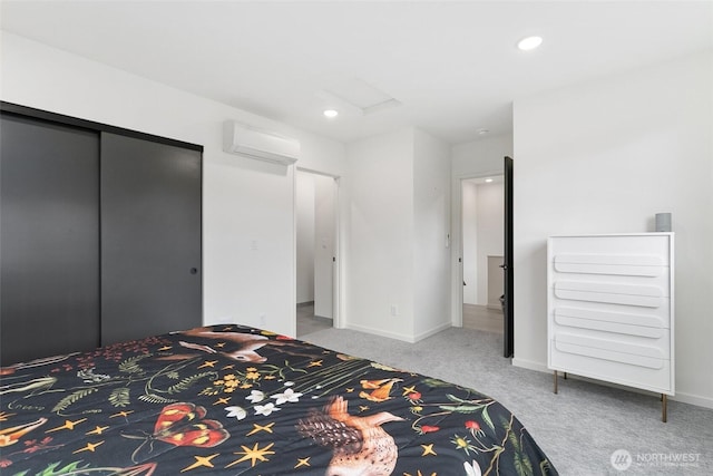 carpeted bedroom featuring attic access, baseboards, an AC wall unit, and recessed lighting