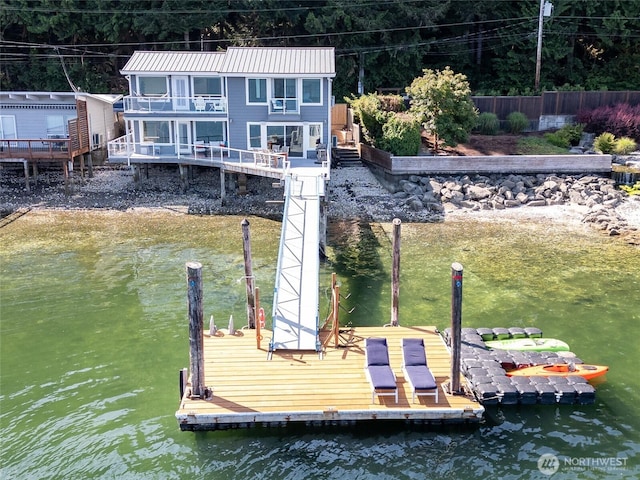 dock area featuring a water view and stairs