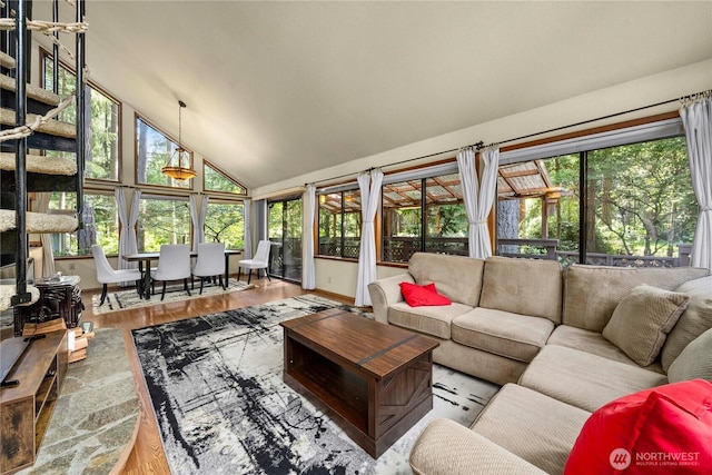 sunroom featuring vaulted ceiling