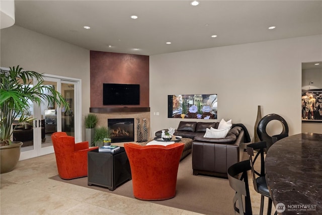 living area with recessed lighting and a large fireplace