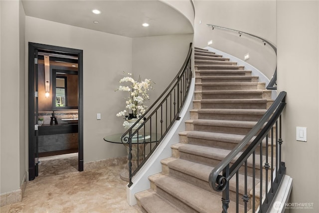 staircase with recessed lighting