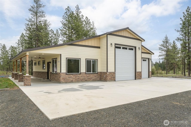 garage featuring concrete driveway and ceiling fan