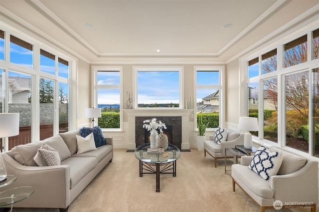 sunroom / solarium featuring a high end fireplace