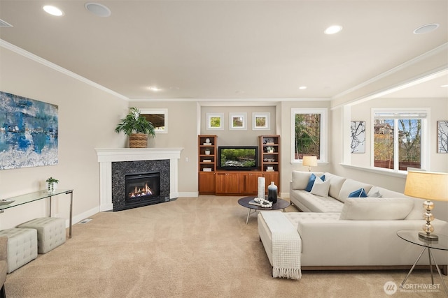 living room with baseboards, light colored carpet, and crown molding