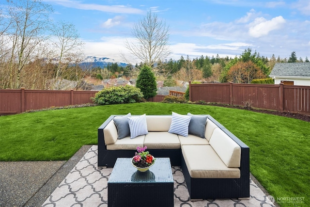 view of patio / terrace featuring an outdoor living space and a fenced backyard