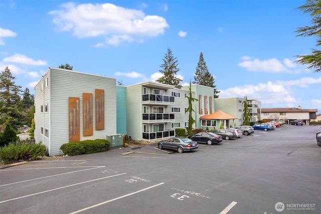 view of property featuring uncovered parking