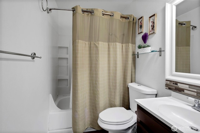 bathroom featuring toilet, shower / bath combination with curtain, and vanity