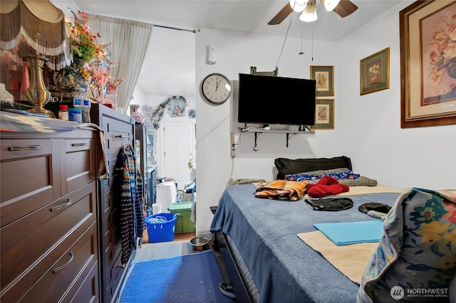 bedroom with ceiling fan and wood finished floors