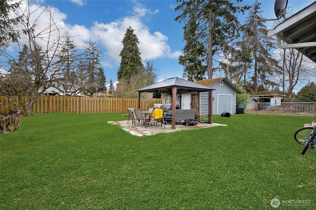 view of yard with a fenced backyard, a patio, and a gazebo