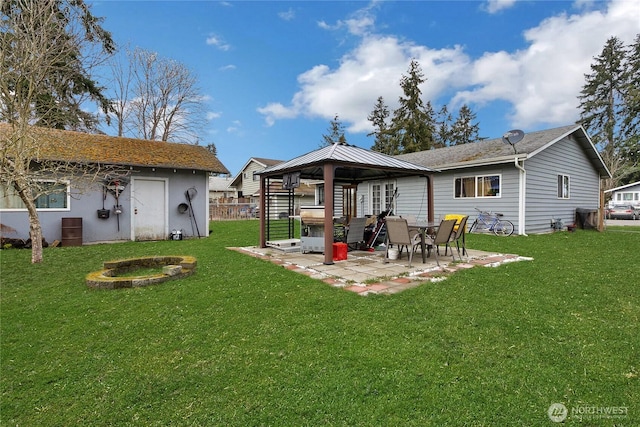 back of house with a patio area, fence, a lawn, and a gazebo