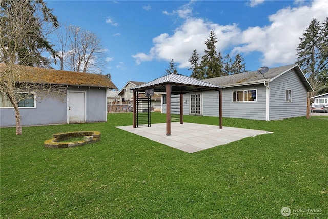 exterior space with a patio area, a lawn, and a gazebo