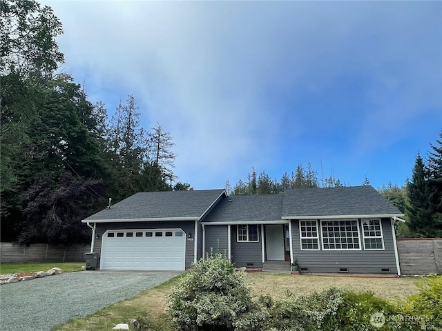 single story home with driveway, a shingled roof, crawl space, an attached garage, and fence