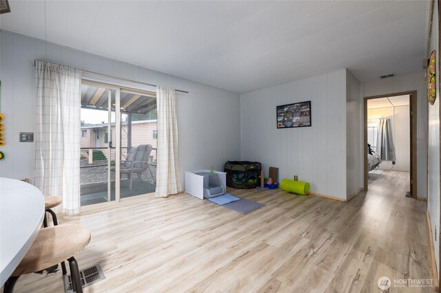 interior space featuring light wood-style flooring and visible vents