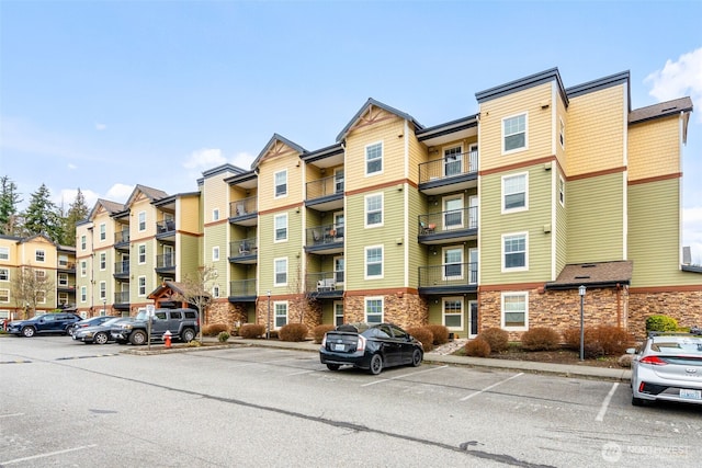 view of property featuring uncovered parking