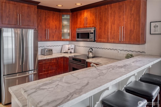 kitchen with stainless steel appliances, glass insert cabinets, backsplash, and light stone countertops