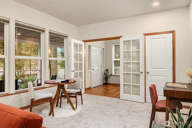 carpeted office space with recessed lighting, baseboards, and french doors