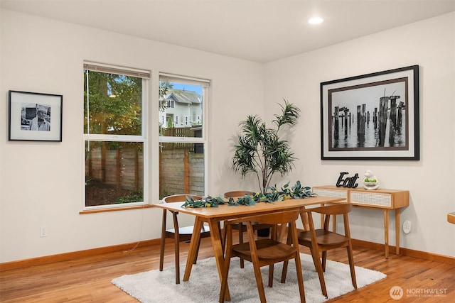 dining room featuring recessed lighting, baseboards, and light wood finished floors