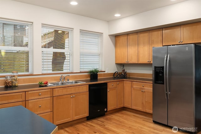 kitchen featuring stainless steel fridge, dishwasher, light wood-type flooring, a sink, and recessed lighting