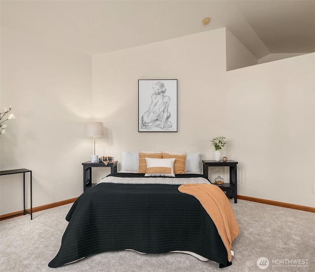 carpeted bedroom featuring vaulted ceiling and baseboards