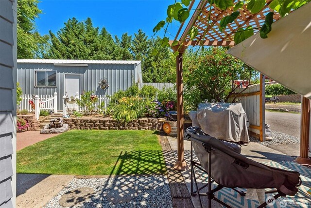 view of yard with a pergola and fence