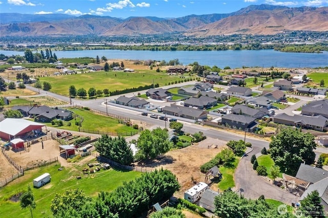 aerial view featuring a residential view and a water and mountain view