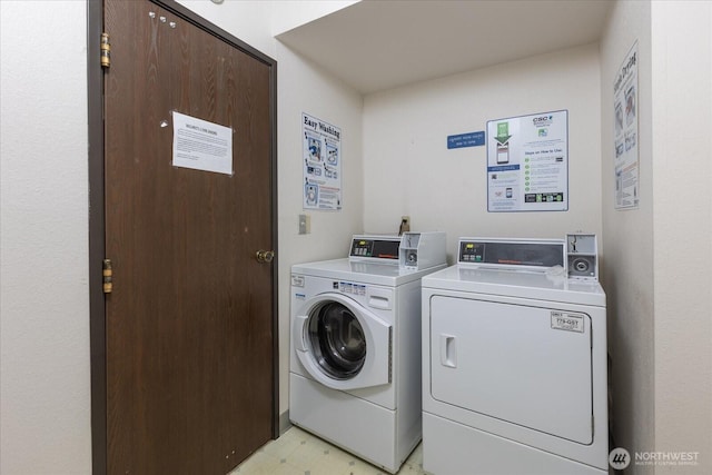 laundry area featuring light floors and independent washer and dryer