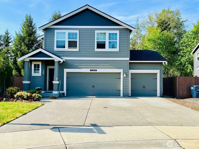 5609 151st Street Ct E, Puyallup, WA 98375 - view of front facade featuring fence, concrete driveway, and an attached garage