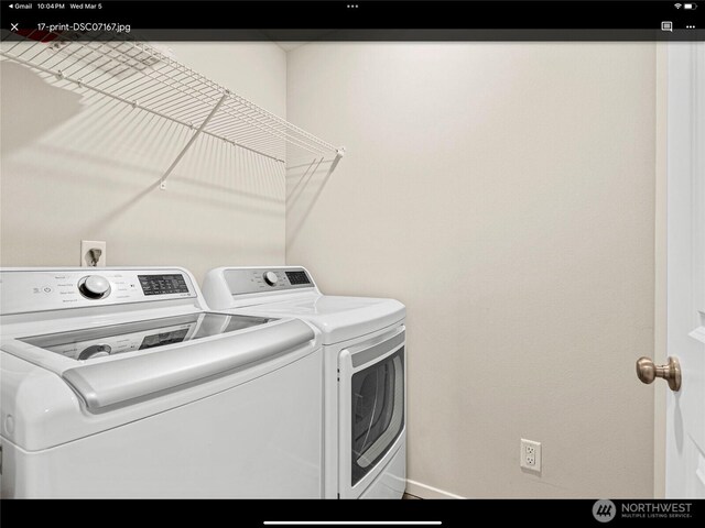 5609 151st Street Ct E, Puyallup, WA 98375 - clothes washing area with washing machine and dryer and baseboards