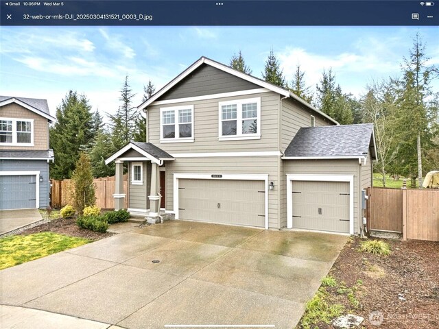 5609 151st Street Ct E, Puyallup, WA 98375 - traditional-style house featuring fence, driveway, and an attached garage