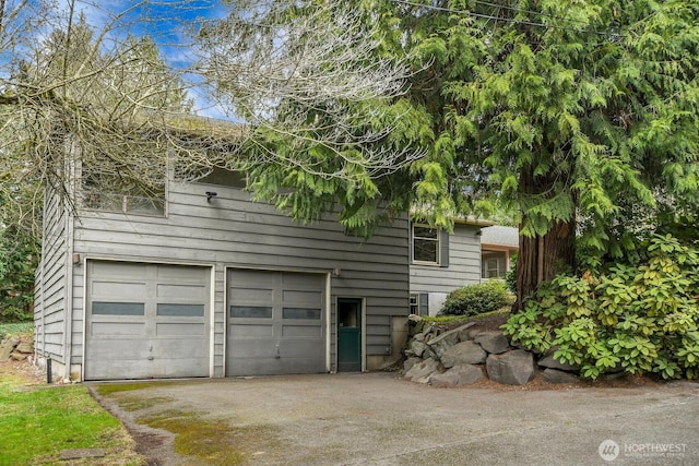 exterior space with a garage and driveway