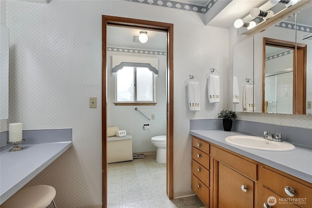 full bathroom with tile patterned floors, toilet, and wallpapered walls