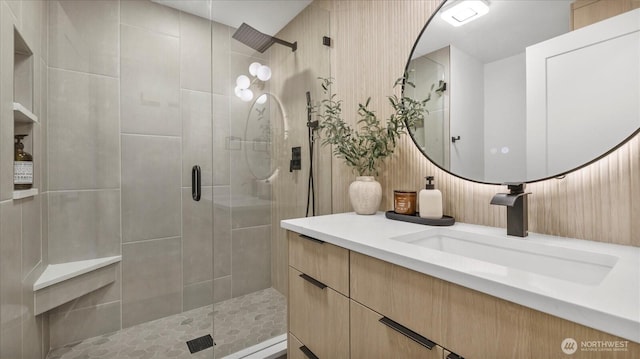 full bathroom with a stall shower and vanity