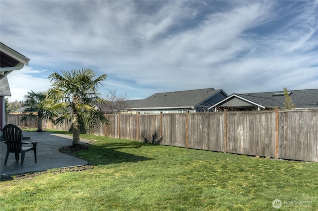 view of yard with a fenced backyard and a patio