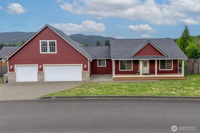 130 Summit Loop, Mccleary, WA 98557 - view of front of property featuring fence, roof with shingles, a porch, a mountain view, and driveway