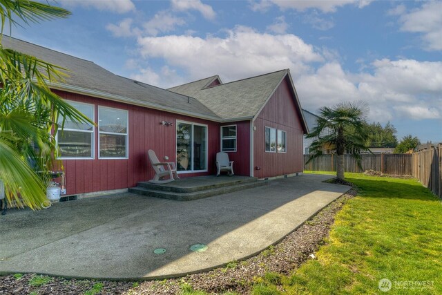 130 Summit Loop, Mccleary, WA 98557 - back of property with fence, a patio, a shingled roof, and a yard