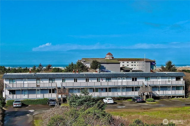 view of property with uncovered parking