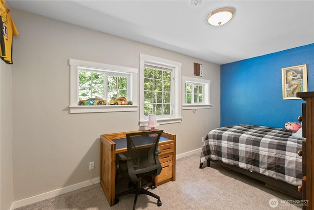 bedroom featuring carpet flooring and baseboards