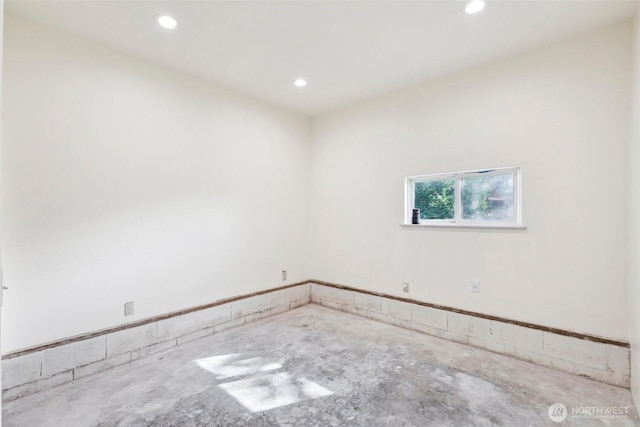 empty room with recessed lighting