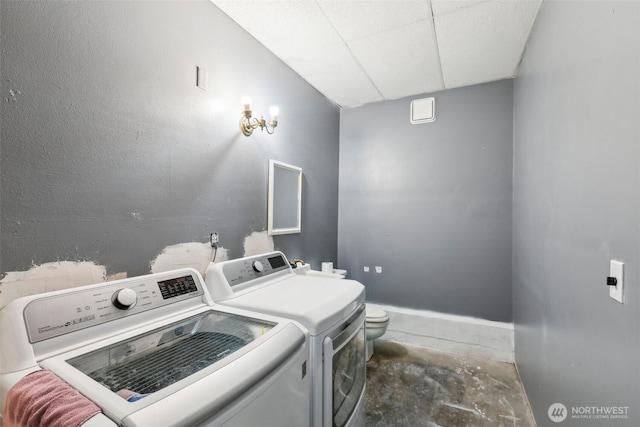 laundry area with laundry area and separate washer and dryer