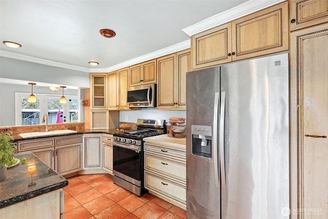 kitchen featuring light tile patterned floors, stainless steel appliances, glass insert cabinets, ornamental molding, and a sink